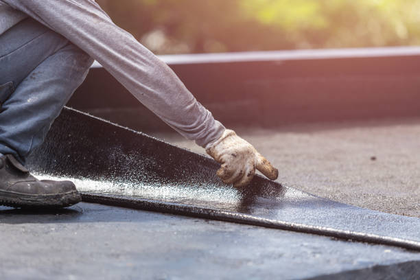 Professional Basement Waterproofing technician working in Burton, MI